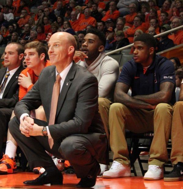 John Groce sits on the sidelines with Aaron Cosby and Rayvonte Rice.