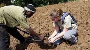 Shea Belahi teaches farmers in Tanzania about soil health.