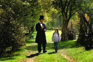 As Lincoln, Klein speaks with a young girl. 