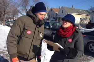 Two people going door-to-door during a political campaign