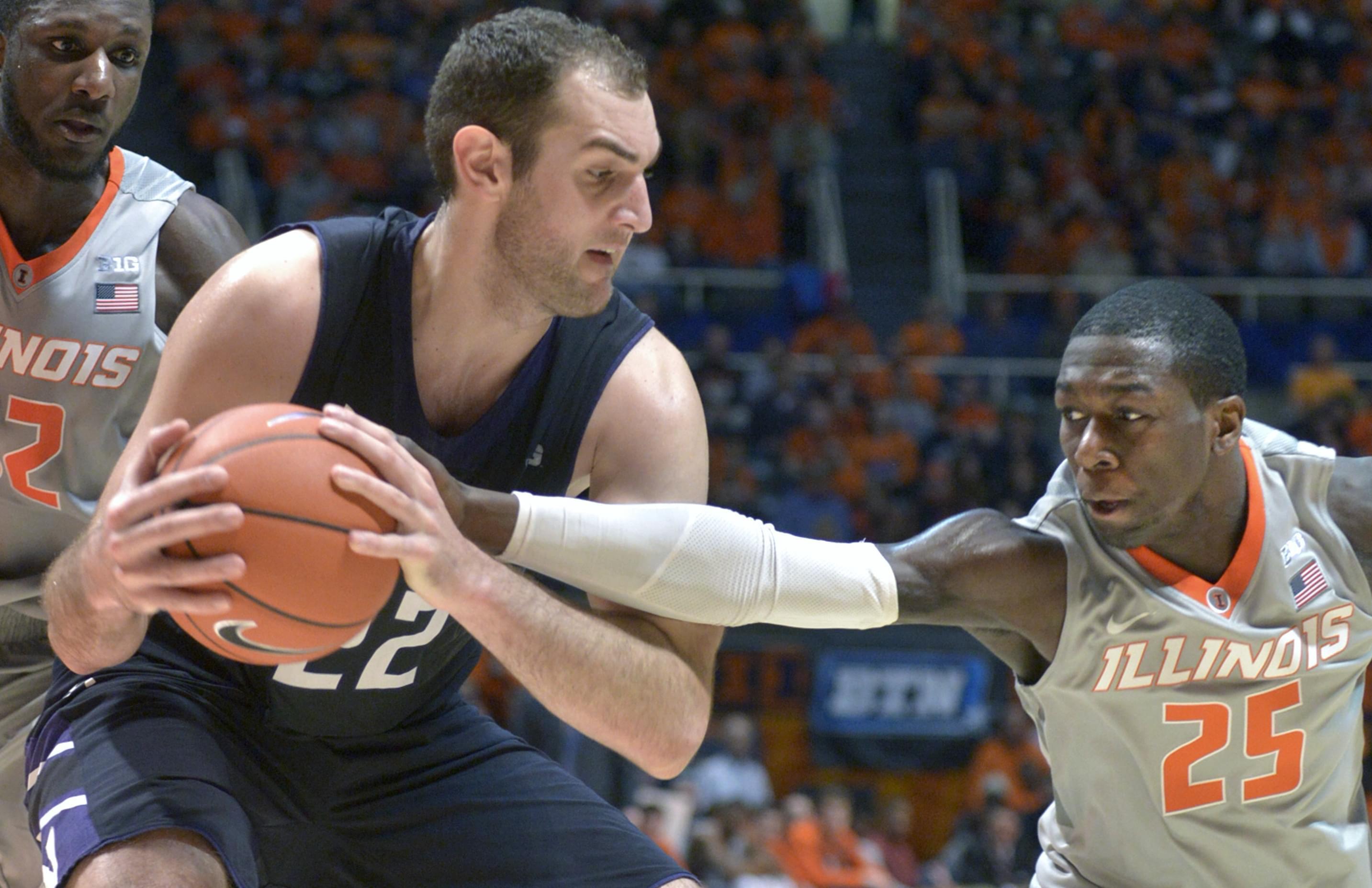 Illini guard Kendrick Nunn tries to take the ball from Northwestern's Alx Olah during Saturday's win.