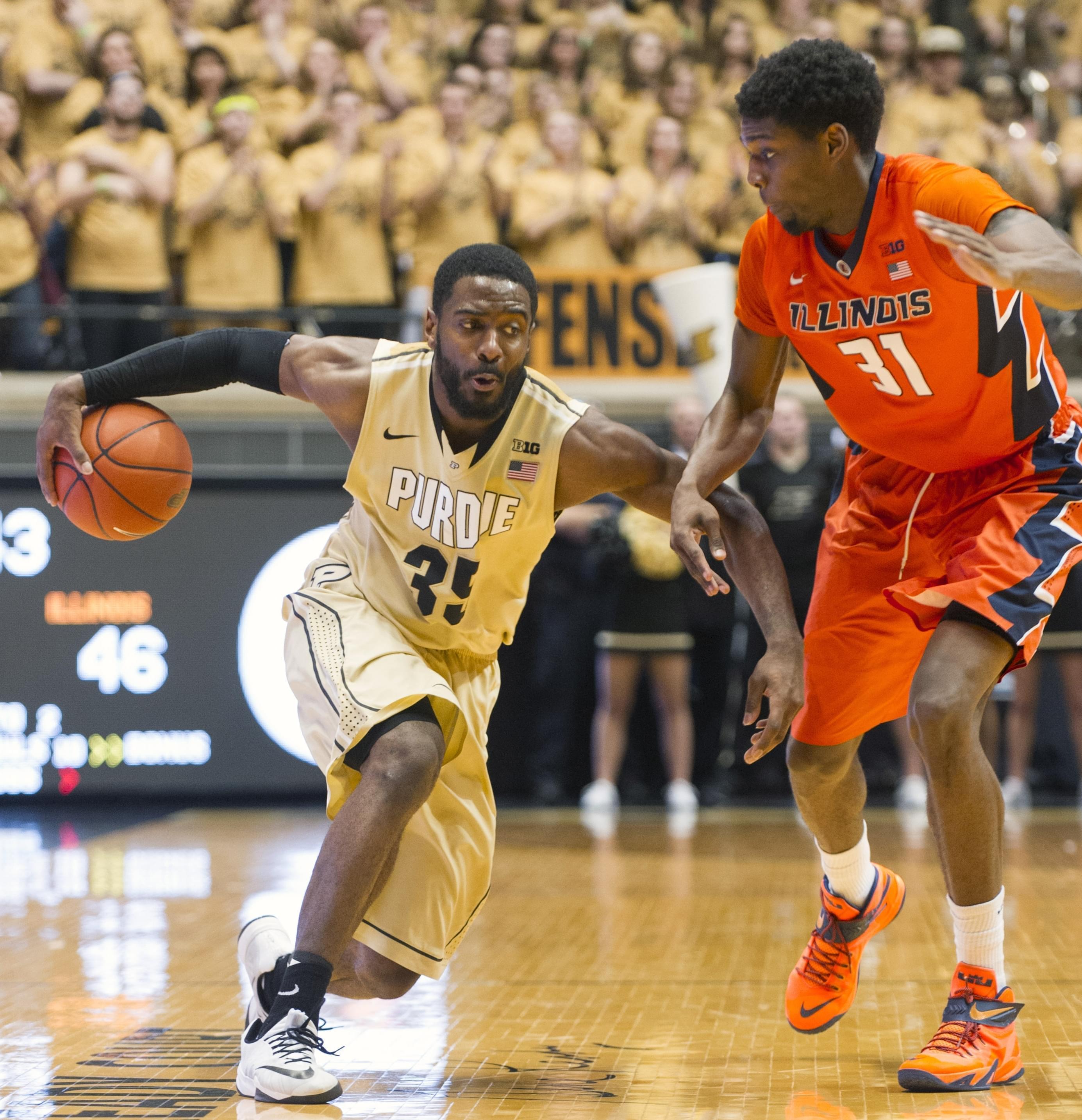 Purdue guard Rapheal Davis makes a move on Illinois forward Austin Colbert during the second half of Saturday's 63-58 loss at Purdue.