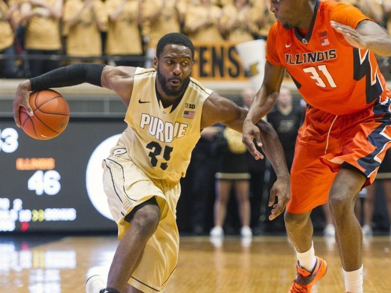 Purdue guard Rapheal Davis makes a move on Illinois forward Austin Colbert during the second half of  Saturday's 63-58 loss at Purdue.