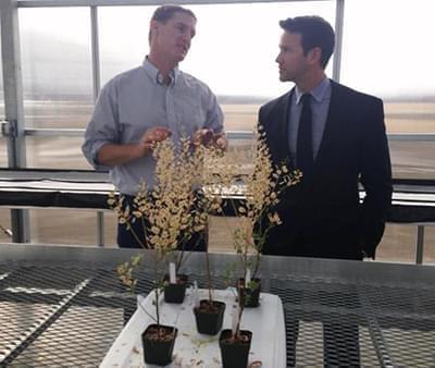 Congressman Aaron Schock visits with WIU agricultural professor Win Phippen.
