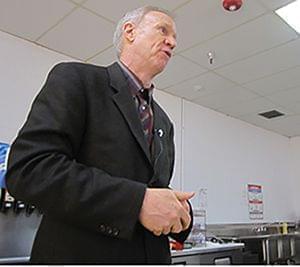 Gov. Bruce Rauner visits with employees of Combe Laboratories in Rantoul on March 11.