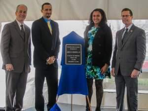 Burgess' grandchildren (Stephen, 2nd from left, and Mariah) are joined by USPS Gateway District Manager David Martin and Congressman Rodney Davis at Friday's dedication ceremony.