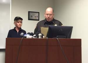 McLean County Sheriff Jon Sandage joined by Coroner Kathleen Davis as he reads a statement to reporters Tuesday.