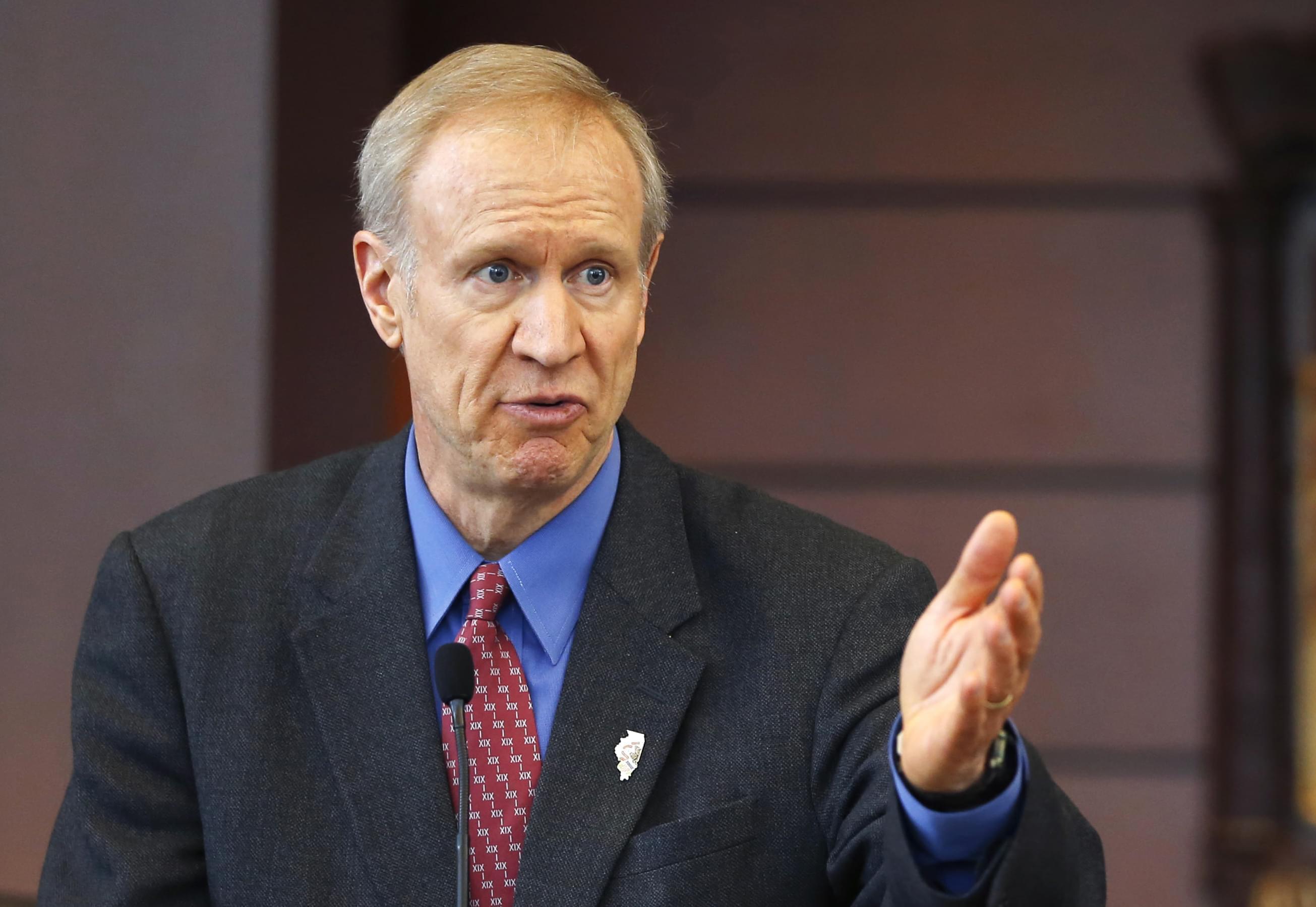Illinois Gov. Bruce Rauner speaks at a news conference in Chicago. A bipartisan agreement to plug a $1.6 billion budget hole including more than $1.3 billion in fund transfers from a variety of sources to avert shutdowns of Illinois state programs an