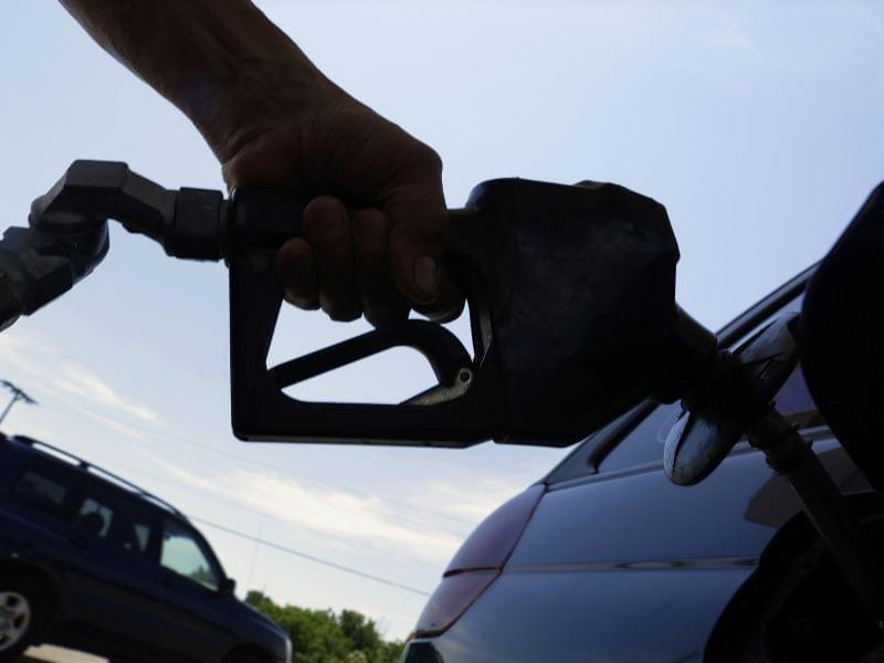 A motorist puts fuel in his car.