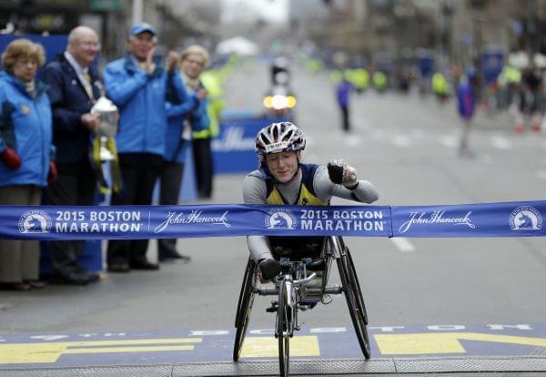 U of I graduate Tatyana McFadden crosses the finish line to win the women's wheelchair division of the Boston Marathon Monday.