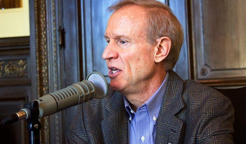 Gov. Bruce Rauner sits for an interview with public radio on Tuesday in his Capitol office. 