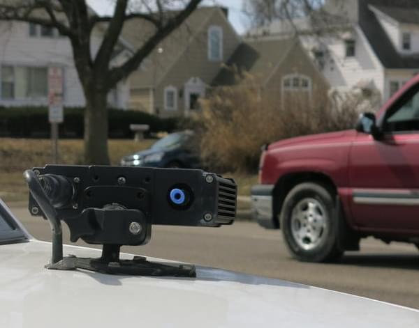 a license plate scanner on top of a police car.