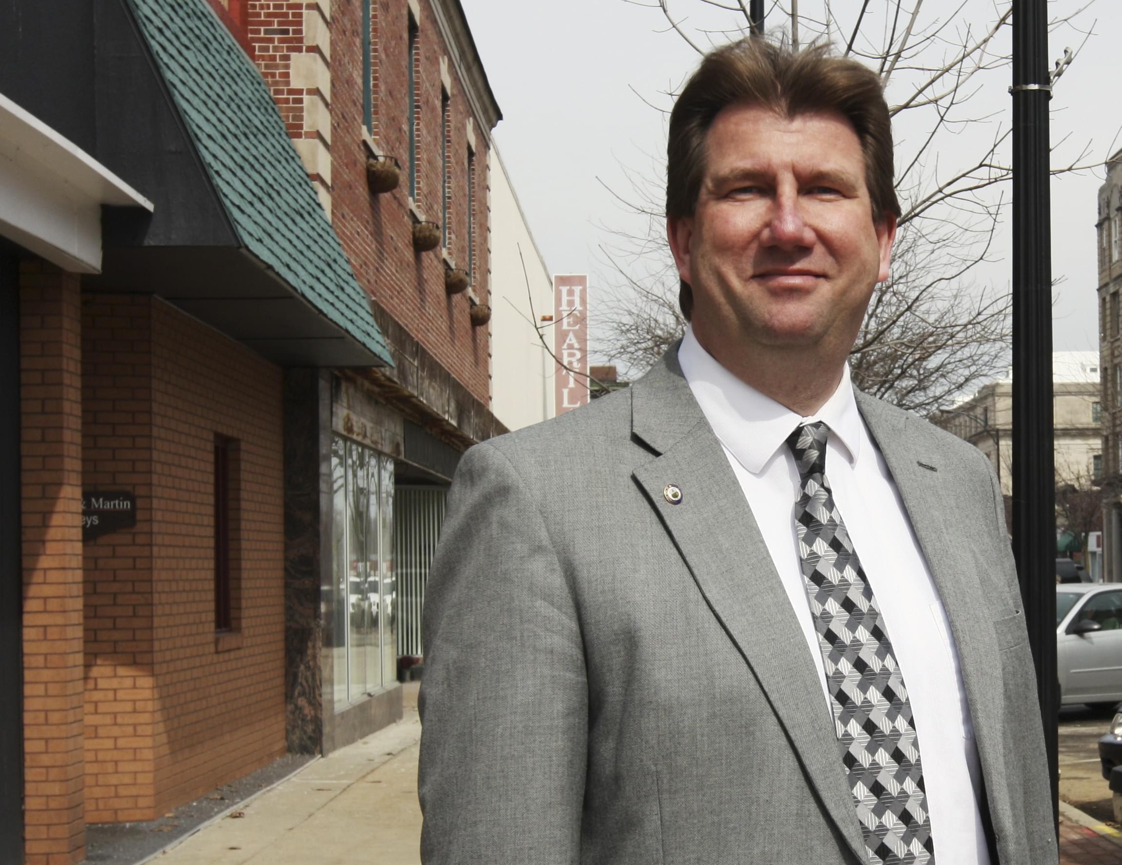 In this March 11, 2014 photo, Scott Eisenhauer, the mayor of Danville, poses for a photo in the downtown area