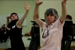 A dancer from the Mark Morris Dance Group demonstrates poses at a Dance for People With Parkinson's class.