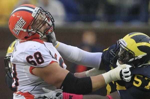 Simon Cvijanovic playing for Illinois in 2012, going up against Frank Clark of Michigan.