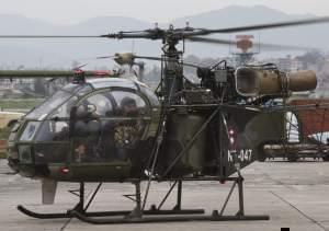 A Napalese army chopper, that spotted the suspected wreckage of the US Marine helicopter, lands in Kathmandu.