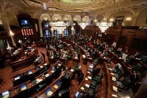 In this Jan. 9, 2015, file photo, Illinois lawmakers listen to Illinois Speaker of the House Michael Madigan in Springfield.