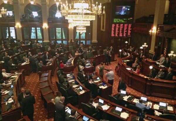 Members of the Illinois assembly meet in the House chambers, at the state Capitol. Pieces of Illinois Democrats' proposed state budget are coming into focus as lawmakers begin advancing them in the Legislature ahead of a scheduled Sunday adjourn
