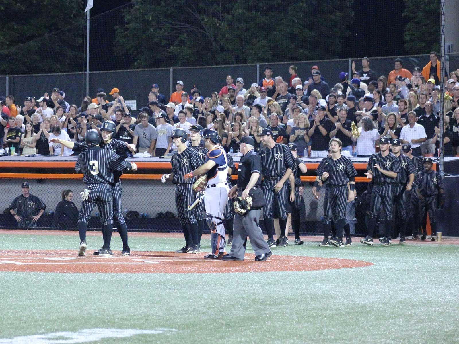 Vanderbilt fans cheer on right fielder Jeren Kendall, whose 2-run homer gave the team an 11-0 lead Saturday night at Illinois Field.