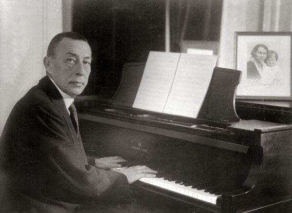 A man seated at a piano.