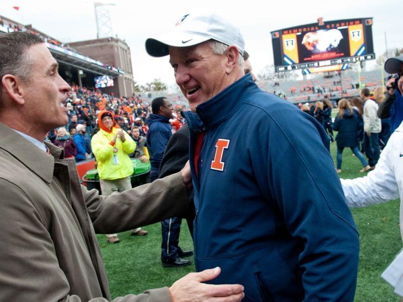 Illinois athletic director Mike Thomas greets offensive coordinator Bill Cubit and head coach Tim Beckman after beating Penn State on Nov. 22, 2014, at Memorial Stadium in Champaign. 