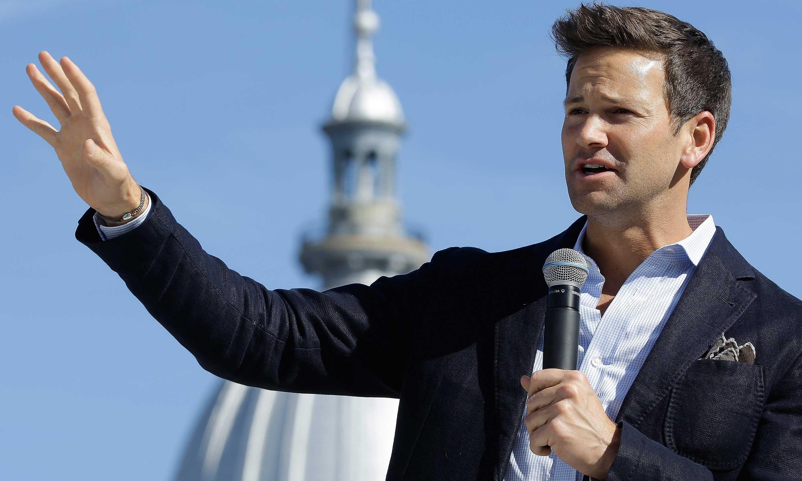 Former U.S. Rep. Aaron Schock, R-Ill., speaks in support of Republican gubernatorial candidate Bruce Rauner during a campaign rally outside the State Capitol in Springfield, Monday, Nov. 3, 2014. 