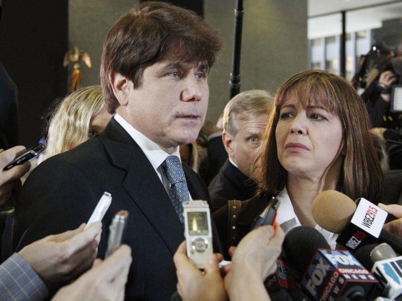  In this Dec. 7, 2011 file photo, former Illinois Gov. Rod Blagojevich, left, speaks to reporters as his wife, Patti, listens at the federal building in Chicago, after Blagojevich was sentenced to 14 years on 18 corruption counts.