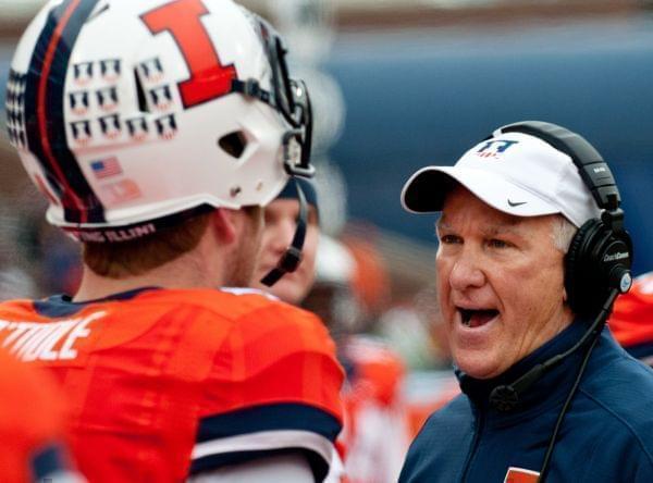 In this Nov. 22, 2014, file photo, new Illinois coach and offensive coordinator Bill Cubit talks to quarterback Reilly O'Toole (4) during a game against Penn State in Champaign, 
