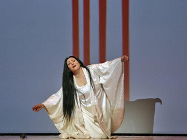 A solo woman onstage for Madame Butterfly