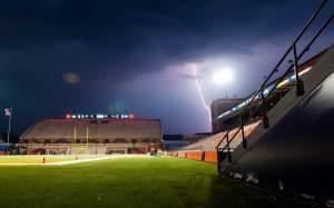Lightning strikes in the vicinity of an empty Memorial Stadium on Friday, Sept. 4, 2015, in Champaign. 
