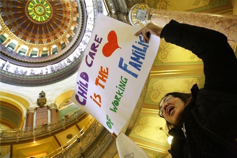 Erica Hurtado of Chicago, participates in a rally to save Illinois child care programs for children and working families in the rotunda at the Illinois State Capitol Thursday, Feb. 19, 2015, in Springfield, Ill. 