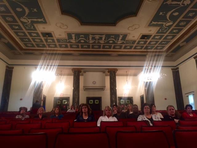 Most of the audience at a legislative hearing on massive cuts to a program that helps students and working parents pay for daycare was mostly comprised of daycare providers and affected mothers; only one legislator was spotted in attendance. All legi