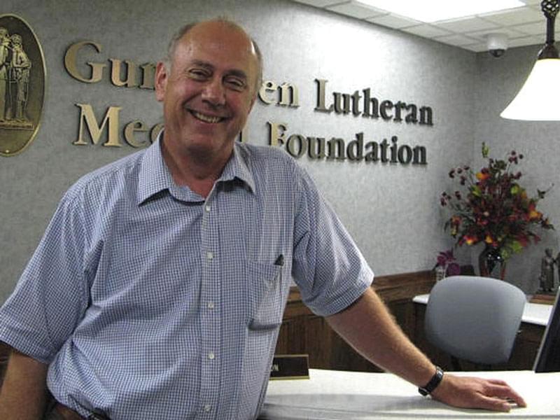 Bernard Hammes standing in front of a desk at Gundersen Health Systems.