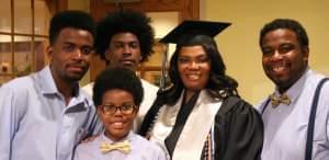 Ricca Louissaint is surrounded by her husband Roosevelt Louissaint and their three sons -- Gabe (far left), Elijah and Matthew (front) -- on graduation day.