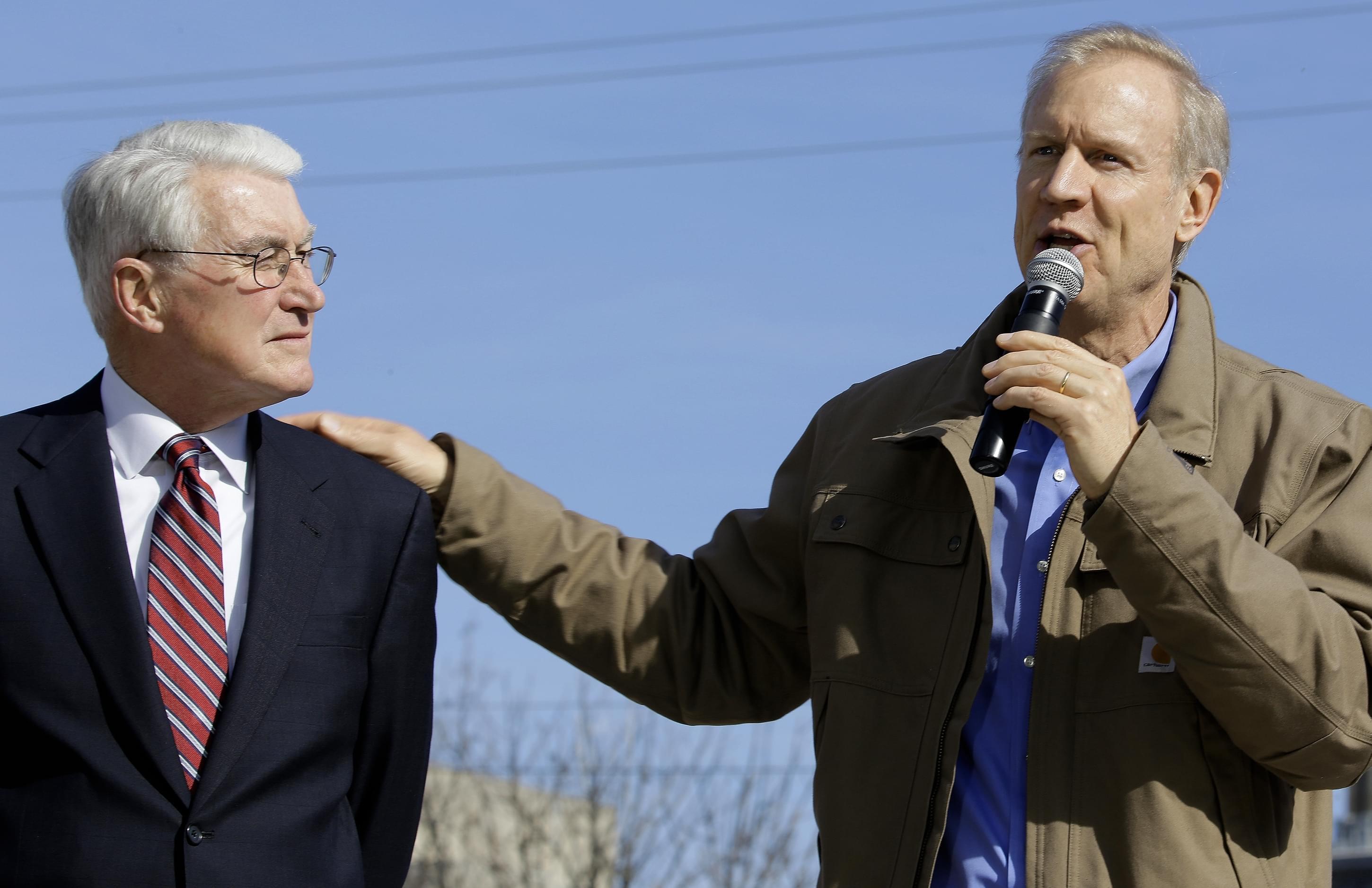 In this Nov. 3, 2014 file photo, former Governor of Illinois Jim Edgar, left, shows his support of Republican gubernatorial candidate Bruce Rauner, right, during a campaign rally in Springfield. Edgar, who ran the state from 1991 to 1999, is pressing