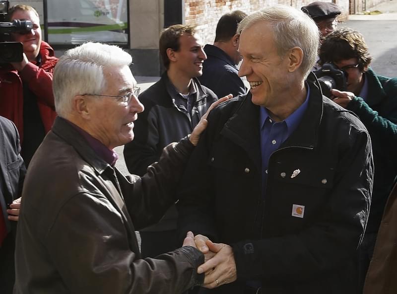 In this Nov. 7, 2014, file photo, Illinois Gov.-elect Bruce Rauner, right, greets former Republican Illinois Gov. Jim Edgar in Springfield, Ill. Pressure is building for Republican Gov. Rauner and majority Democrats to end their months-long stalemate