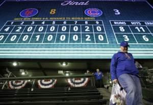 A Cubs fan leaves Wrigley Field after Game 4 of the National League baseball championship series against the New York Mets 8-3 Wednesday, Oct. 21, 2015, in Chicago. 