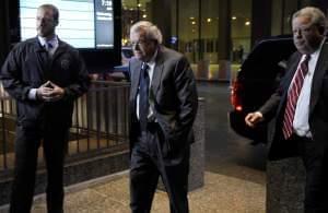 Former House Speaker Dennis Hastert, center, arrives at the federal courthouse Wednesday, Oct. 28, 2015, in Chicago, where he is scheduled to change his plea to guilty in a hush-money case that alleges he agreed to pay someone $3.5 million to hide cl