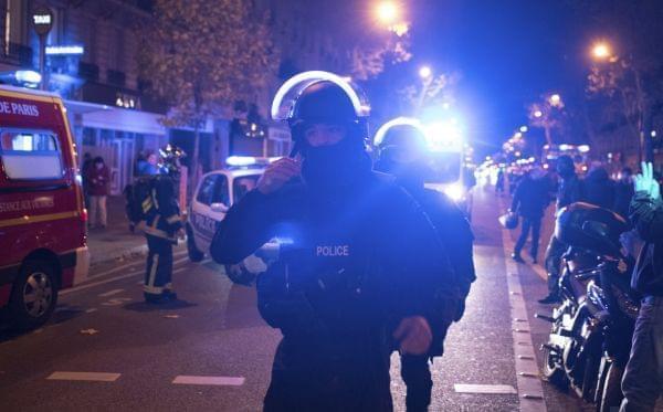 Elite police officers arrive outside the Bataclan theater in Paris, France.