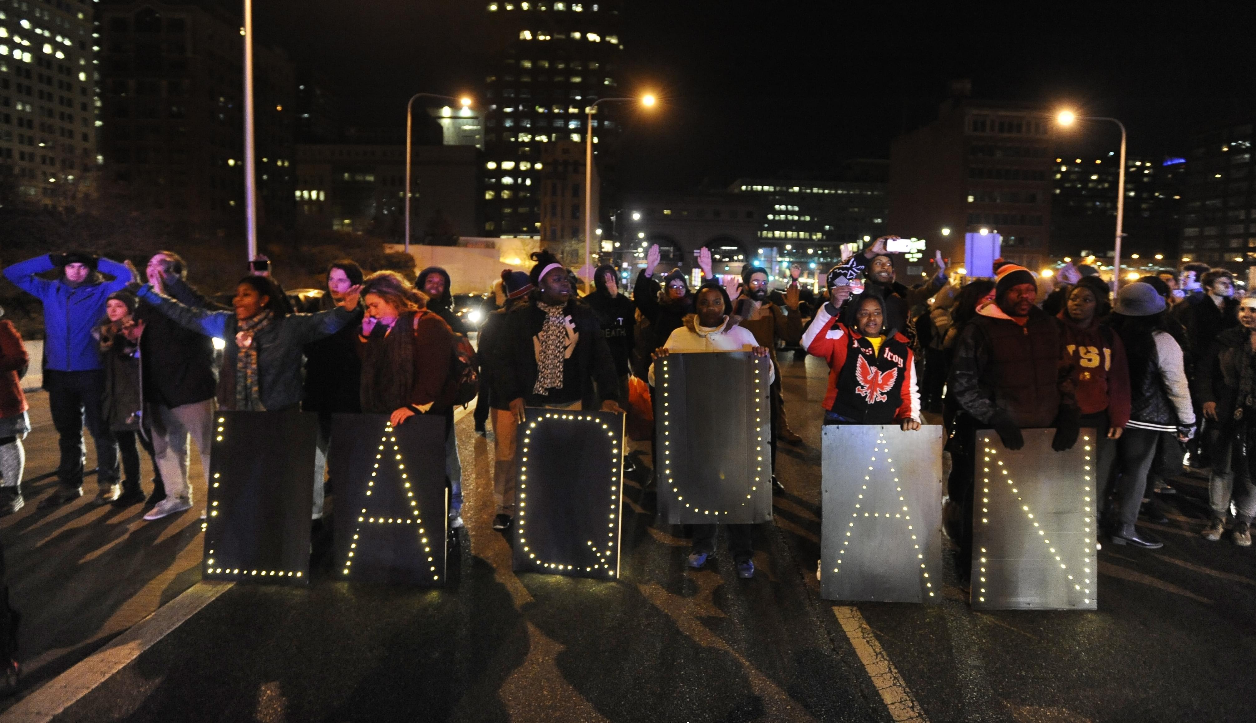 Protesters march during a demonstration for 17-year-old Laquan McDonald, Tuesday, Nov. 24, 2015, in Chicago.
