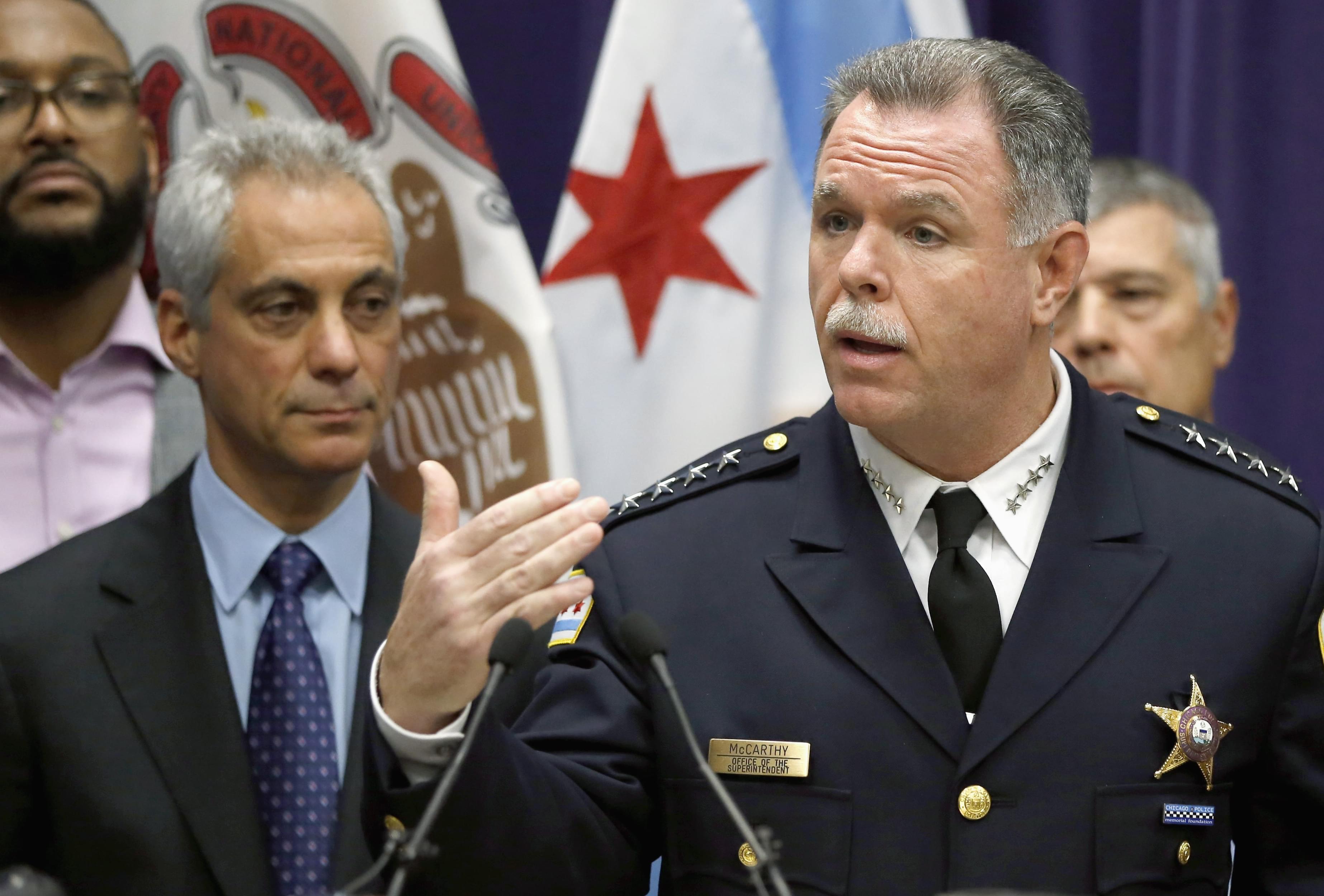In this Nov. 24, 2015 file photo, Chicago Police Superintendent Garry McCarthy, right, speaks about first-degree murder charges against police officer Jason Van Dyke in the death of 17-year-old Laquan McDonald, as Mayor Rahm Emanuel looks on at left