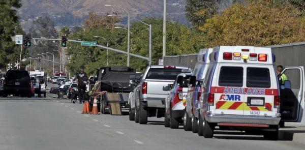 Law enforcement members line up near the the site of a mass shooting on Wednesday, Dec. 2, 2015 in San Bernardino, Calif. One or more gunmen opened fire Wednesday at a Southern California social services center, shooting several people as others lock