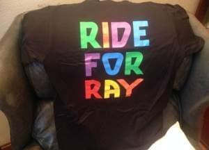 A black tee shirt reading Ride for Ray.