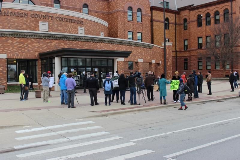 Twenty protesters laid on the sidewalk outside the courthouse as Kadeem Fuller read the names of fifty black men and women who had died at the hands of police officers.