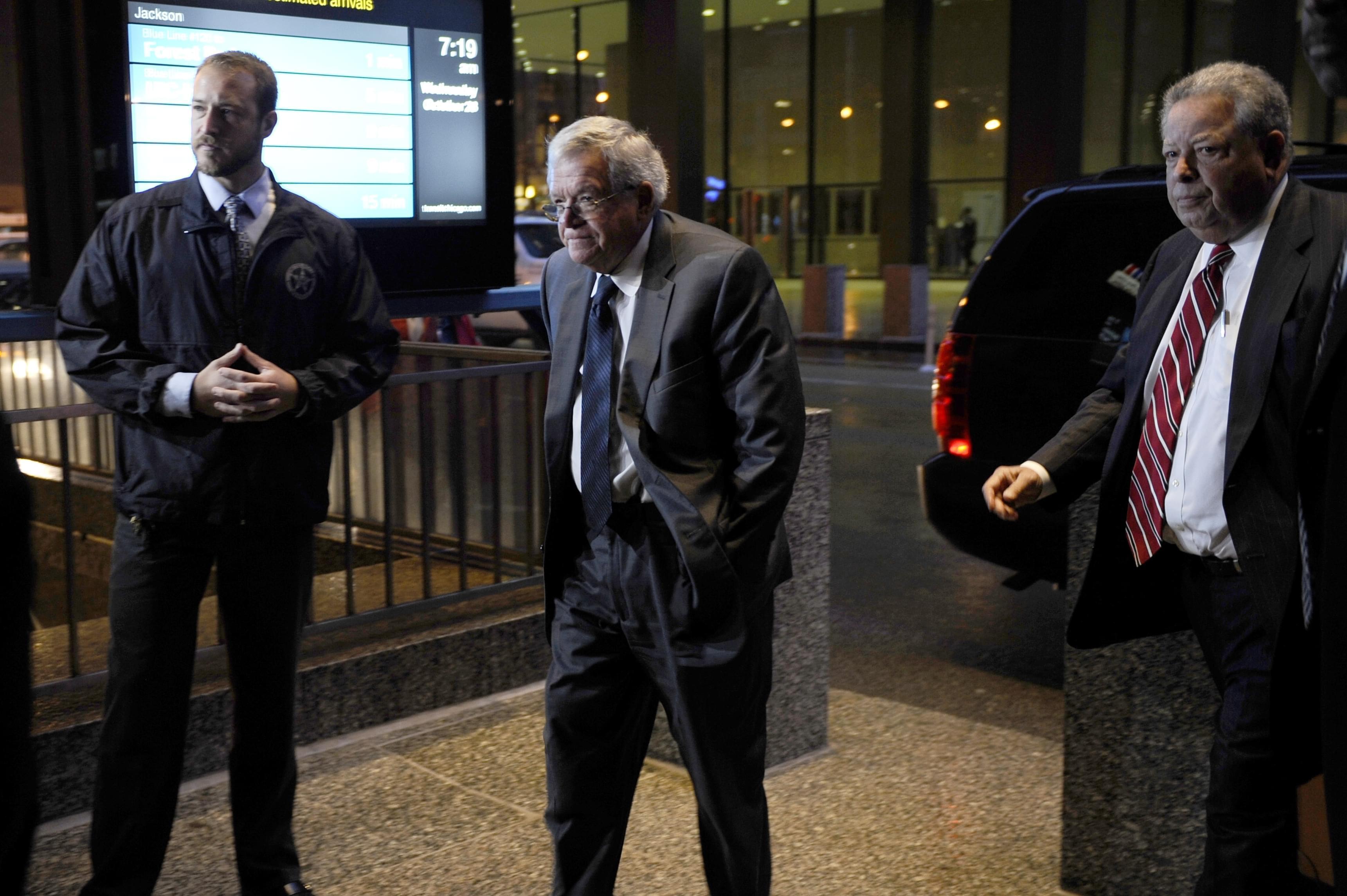 Former House Speaker Dennis Hastert, center, arrives at the federal courthouse in Chicago