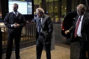 Former House Speaker Dennis Hastert, center, arrives at the federal courthouse in Chicago