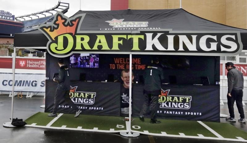 A DraftKings promotions tent in the parking lot of Gillette Stadium, in Foxborough, Mass.