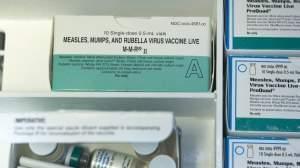 In this Thursday, Jan. 29, 2015, photo, boxes of single-doses vials of the measles-mumps-rubella virus vaccine live, or MMR vaccine and ProQuad vaccine are keep frozen inside a freezer at the practice of Dr. Charles Goodman in Northridge, Calif. 