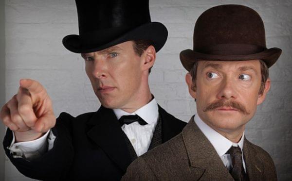 Sherlock and Watson, dressed in Victorian-era clothes. 