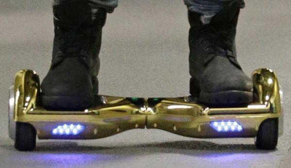 In this Oct. 5, 2015 file photo, Seattle Seahawks wide receiver B.J. Daniels rides through a hallway at CenturyLink Field on an electric self-balancing scooter commonly called a "hoverboard."